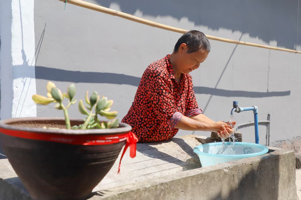 实施城乡供水一体化后，璧山群众用上了干净、平价的自来水。重庆市水利局供图